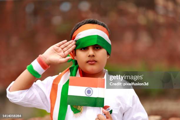 child salute to national flag on independence day - tri color stock pictures, royalty-free photos & images