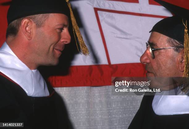 American actor Bruce Willis and former baseball player & manager Yogi Berra attend Montclair State University's graduation ceremony at Continental...