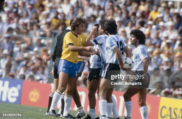 Brazilian attacking midfielder Zico arguing with Argentine soccer players, including Jorge Olguin and Diego Armando Maradona , during Group C -...