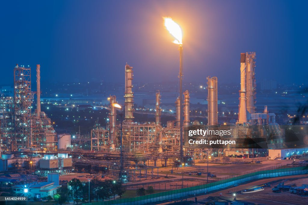 Oil Refinery with tube and oil tank along twilight at beautiful, Refinary plant with oil tank storage, Petrochemical plant, Chemical Plant at sunset