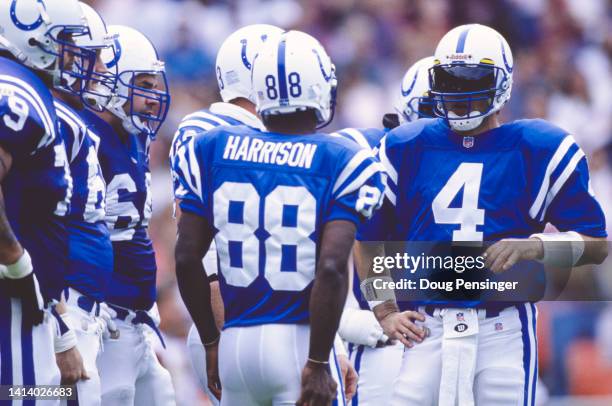 Jim Harbaugh, Quarterback for the Indianapolis Colts gives instructions Wide Receiver Marvin Harrison during the National Football Conference East...