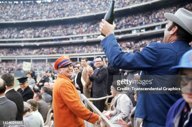 View, on the lower deck of Shea Stadium, as baseball fans celebrate the New York Mets victory, over the Atlanta Braves, in the American League...
