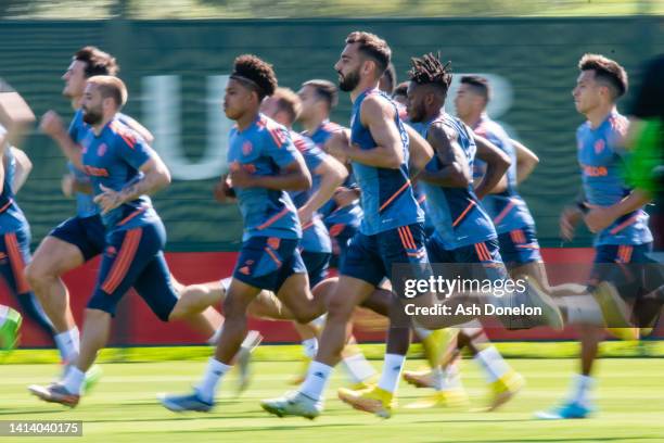 Shola Shoretire, Bruno Fernandes, Fred of Manchester United in action during a first team training session at Carrington Training Ground on August...