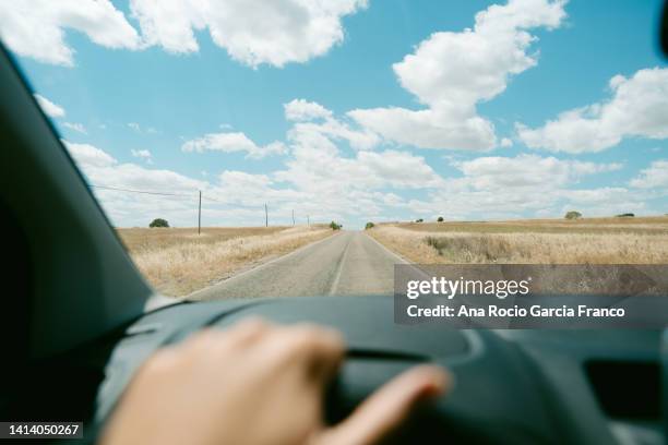 pov of a caucasian person driving along countryside landscape - car point of view stock pictures, royalty-free photos & images