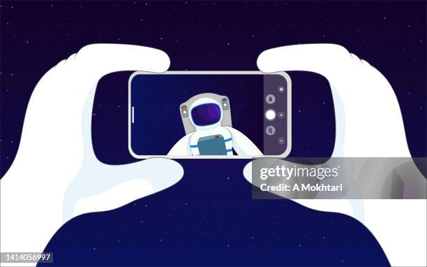 astronaut takes a selfie. - ipad portrait stock illustrations