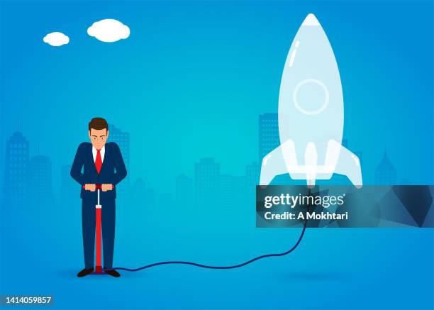 launch a project, an idea, discover space...man inflates a rocket. - firework rocket stock illustrations