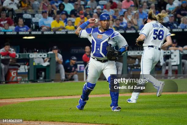 Salvador Perez of the Kansas City Royals throws to first in the eighth inning against the Boston Red Sox at Kauffman Stadium on August 6 in Kansas...