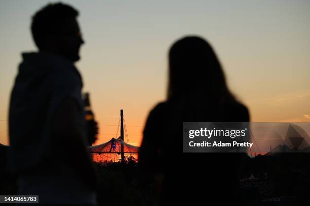 General view of spectators inside the Olympiapark as the sun sets prior to the opening ceremony of the European Championships Munich 2022 at...