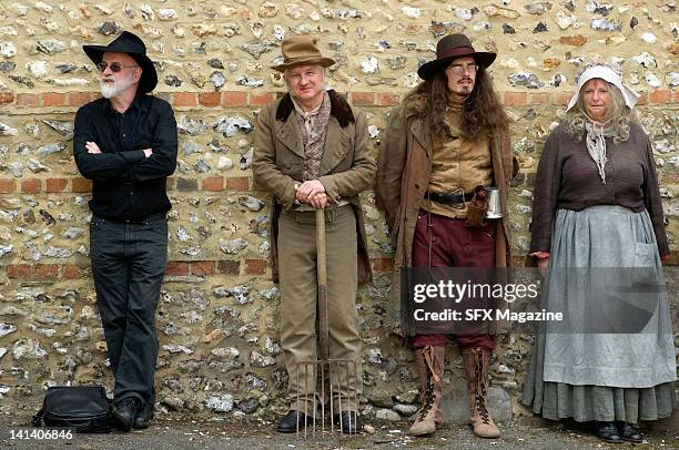 Actors and creator Terry Pratchett on the film set of the TV production of The Colour of Magic created by author Terry Pratchett at Pinewood Studios...