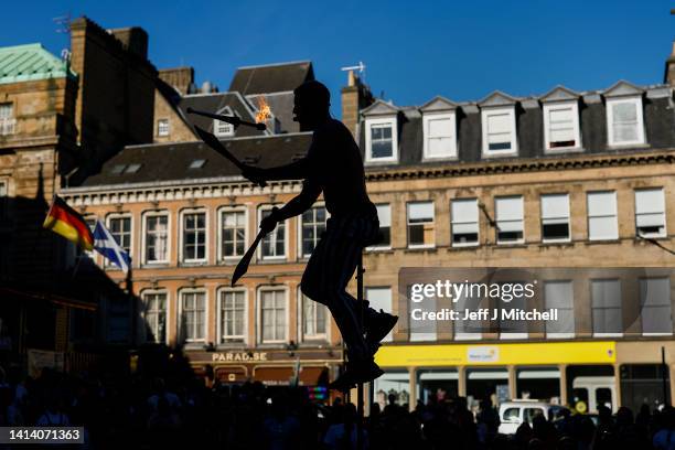 Street entertainer performs on Edinburgh's Royal Mile during the city's Festival Fringe on August 10, 2022 in Edinburgh, Scotland. Thousands of...