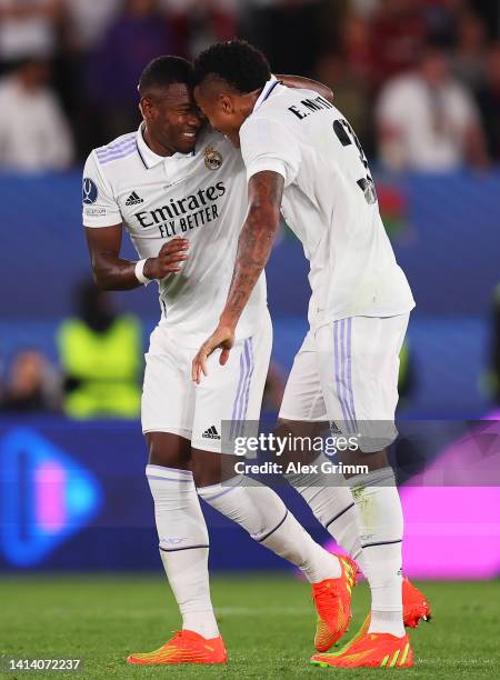 David Alaba of Real Madrid celebrates scoring their side's first goal with teammate Eder Militao during the UEFA Super Cup Final 2022 between Real...