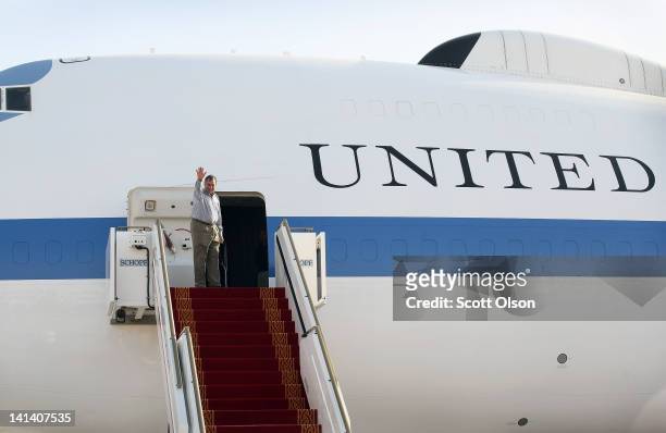 United States Secretary of Defense Leon Panetta waves as he boards his plane to return to Washington, D.C. On March 16, 2012 in Abu Dhabi, United...