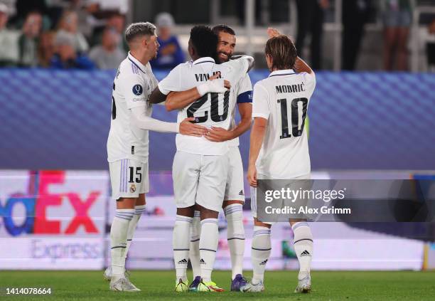 Karim Benzema of Real Madrid celebrates scoring their side's second goal with teammates during the UEFA Super Cup Final 2022 between Real Madrid CF...