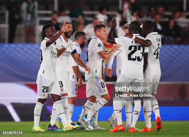 Karim Benzema of Real Madrid celebrates scoring their side's second goal with teammates during the UEFA Super Cup Final 2022 between Real Madrid CF...