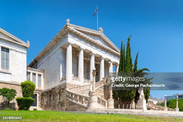 the building of the national library in athens, greece - cypress tree stockfoto's en -beelden