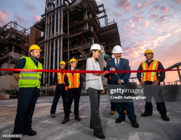 managers or politicians visiting power plant cutting ribbon - ribbon cutting stock pictures, royalty-free photos & images