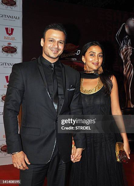 Indian Bollywood actor Vivek Oberoi with his wife Priyanka attend the 'Global Indian Film and TV Honours Awards 2012' in Mumbai on March 15, 2012....