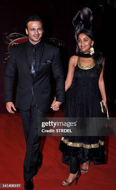 Indian Bollywood actor Vivek Oberoi with his wife Priyanka attend the 'Global Indian Film and TV Honours Awards 2012' in Mumbai on March 15, 2012....