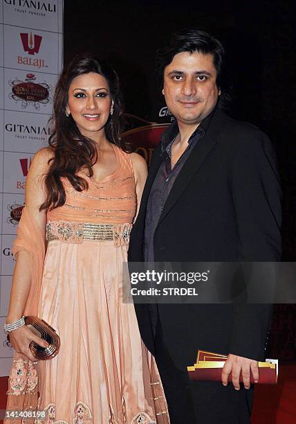 Indian Bollywood actress Sonali Bendre and husband Goldie Behl attend the 'Global Indian Film and TV Honours Awards 2012' in Mumbai on March 15,...