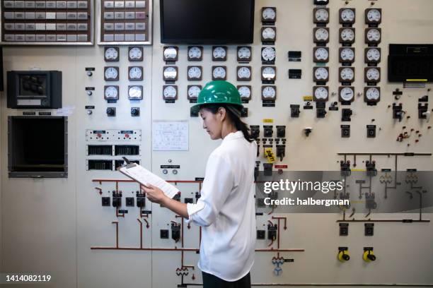 engineer consulting chart in control room - control room stock pictures, royalty-free photos & images