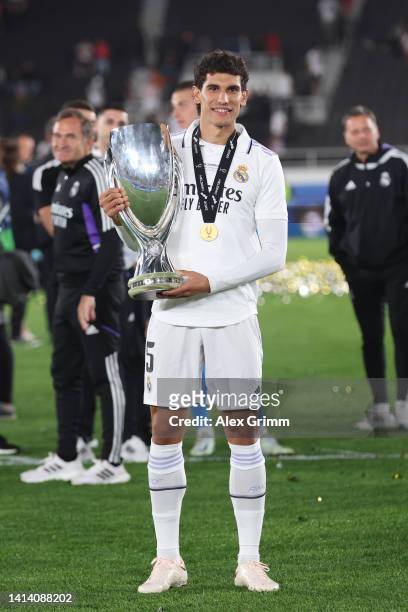 Jesus Vallejo of Real Madrid poses for a photograph with the UEFA Super Cup trophy during the UEFA Super Cup Final 2022 between Real Madrid CF and...