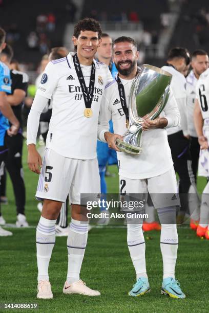 Jesus Vallejo poses for a photograph with Daniel Carvajal of Real Madrid and the UEFA Super Cup trophy after the final whistle of the UEFA Super Cup...
