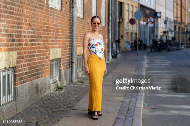 Idalia Salsamendi is seen wearing Top: rotate, yellow Skirt: Malene Birger, Shoes: Prada, Jewelry: Annoushka, Sunglasses: Jimmy Fairly during...