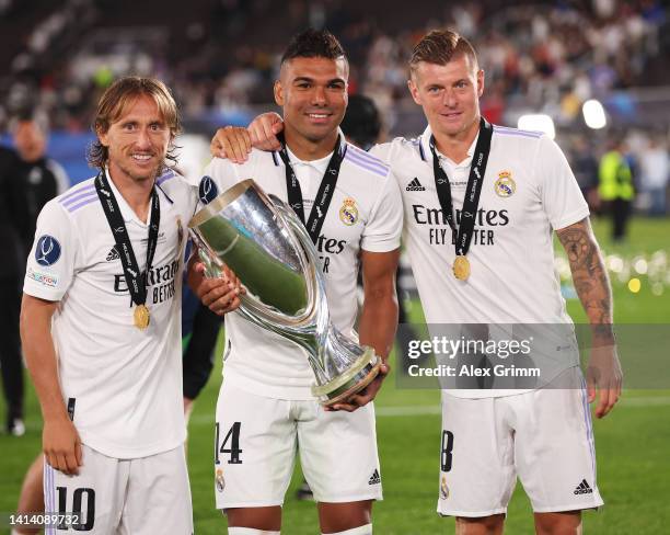 Luka Modric, Casemiro and Toni Kroos of Real Madrid celebrate with the UEFA Super Cup trophy after their sides victory during the UEFA Super Cup...