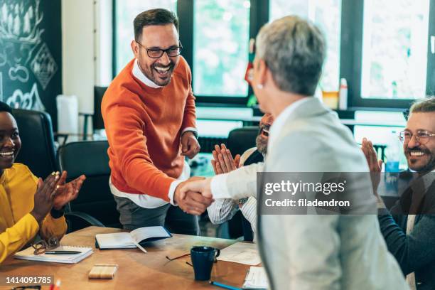 handshake for the new agreements - employee achievement stock pictures, royalty-free photos & images