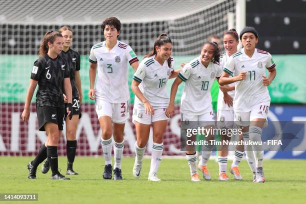 Anette Vazquez of Mexico celebrates with teammates after scoring the second goal against New Zealand at Alejandro Morera Soto on August 10, 2022 in...