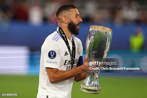 Karim Benzema of Real Madrid celebrates with the trophy following the Real Madrid CF v Eintracht Frankfurt - UEFA Super Cup Final 2022 at Helsinki...