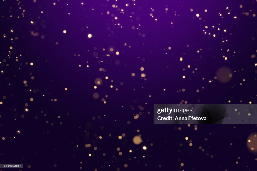 Many blurred bright confetti on purple gradient background. Festive colorful backdrop for your design