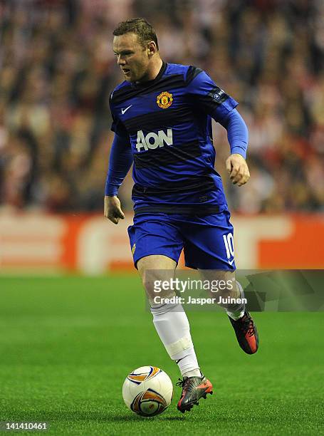 Wayne Rooney of Manchester United runs with the ball during the UEFA Europa League Round 16 second Leg match between Athletic Bilbao and Manchester...