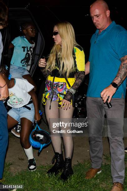 Madonna and daughters, Estere Ciccone and Stella Ciccone, are seen at DiscoOasis at Wolman Rink inCentral Park on August 10, 2022 in New York City.