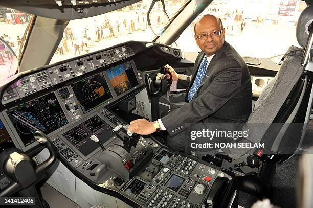 President of Boeing India Dinesh A. Keskar, sits in the cockpit of a newly inducted Boeing 787-8 series Dreamliner during a photo call at the India...