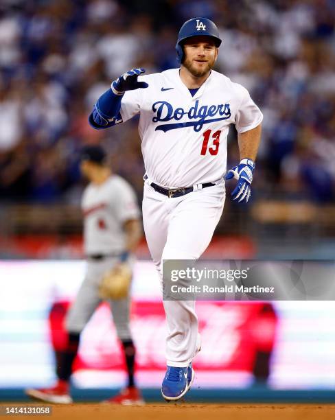 Max Muncy of the Los Angeles Dodgers runs after hitting a home run against the Minnesota Twins in the second inning at Dodger Stadium on August 10,...