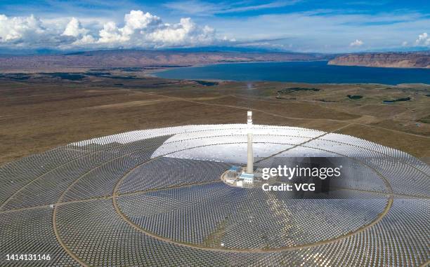 Aerial view of solar panels at a photovoltaic park on August 10, 2022 in Gonghe County, Hainan Tibetan Autonomous Prefecture, Qinghai Province of...