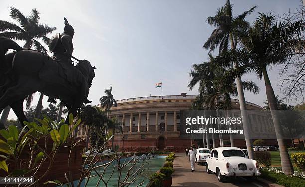 The Indian Parliament building stands in New Delhi, India, on Friday, March 16, 2012. India's economy is expected to grow at 7.6% in the year through...