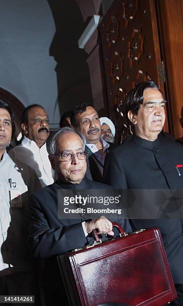 Pranab Mukherjee, India's finance minister, center, arrives with his team to present the budget for the financial year 2012-2013 at the Indian...