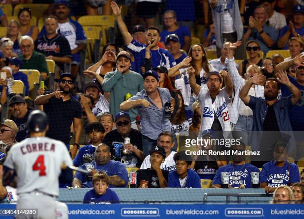 Fans react after Carlos Correa of the Minnesota Twins strikes out against the Los Angeles Dodgers in the seventh inning at Dodger Stadium on August...