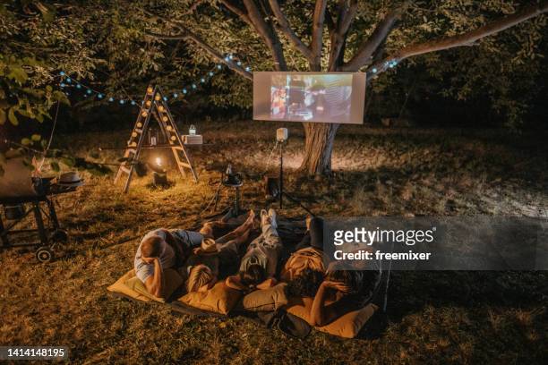 movie night at back yard - backyard movie stock pictures, royalty-free photos & images