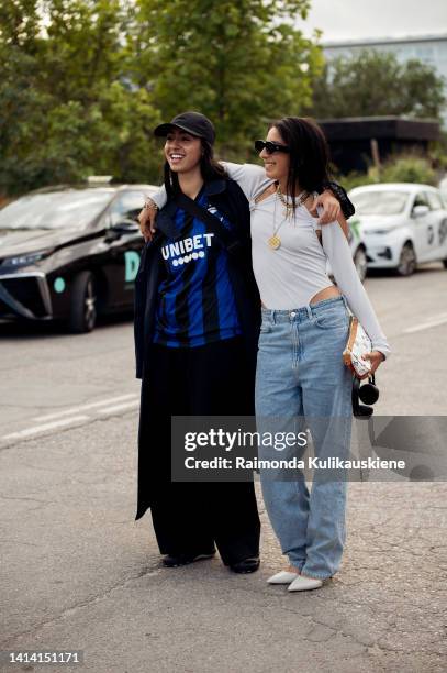 Guest posing, hugging and kissing outside Rabens Saloner show during Copenhagen Fashion Week Spring/Summer 2023 on August 09, 2022 in Copenhagen,...