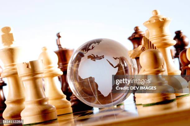 glass globe and chess pieces - glass map india stock pictures, royalty-free photos & images