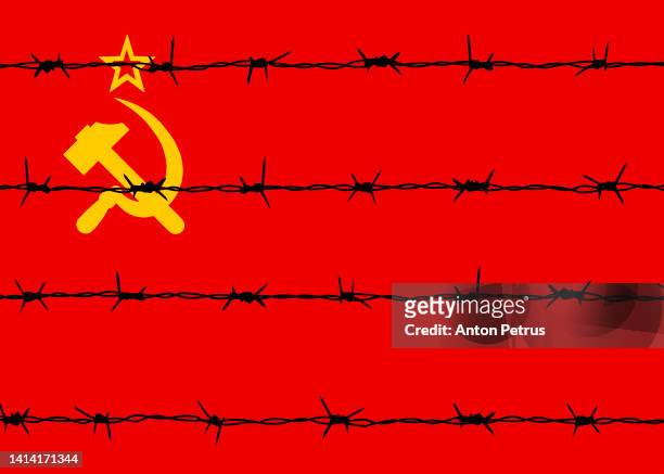 barbed wire on the background of the ussr flag - gulag stock pictures, royalty-free photos & images