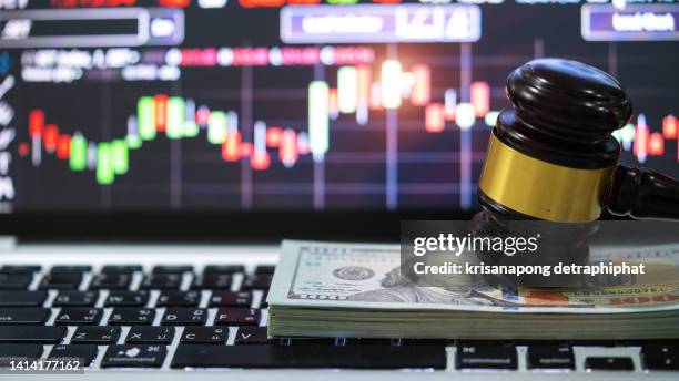 money whit a judge's hammer - government funding stock pictures, royalty-free photos & images