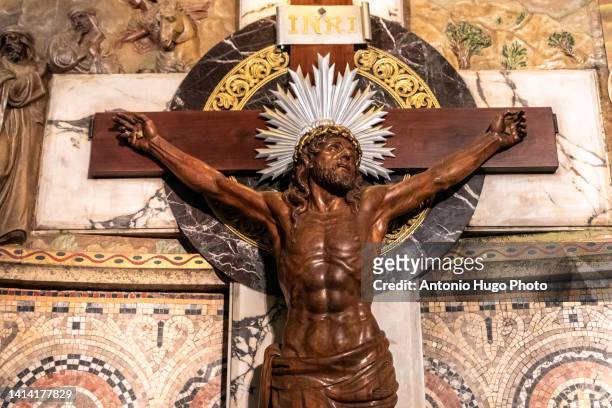 wooden crucified christ inside the temple of the sacred heart of jesus in barcelona, catalonia, spain. - of jesus being crucified stock pictures, royalty-free photos & images