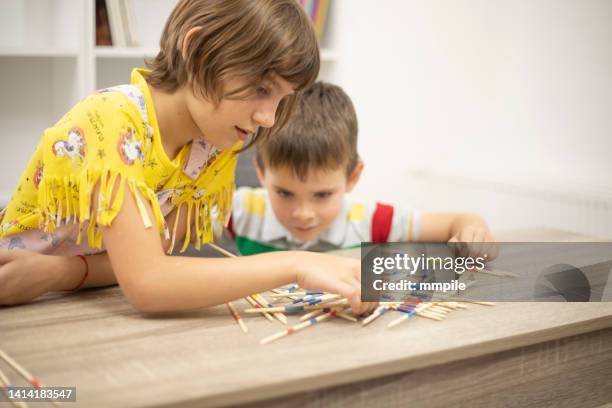 brother and sister having fun together - mikado stock pictures, royalty-free photos & images