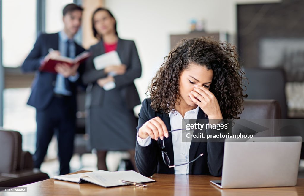 Portrait of burnout businesswoman in an office