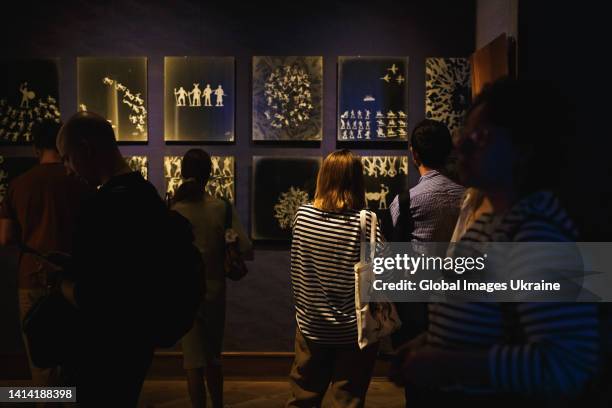 Visitors view exhibits at the opening of Oleh Kalashnik’s exhibition “Toy Soldiers: Invasion” at The Bohdan and Varvara Khanenko National Museum of...