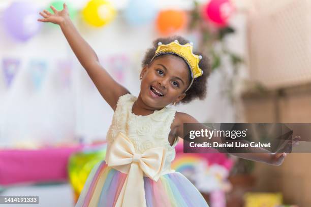 adorable little girl showing excitement with her birthday cake - birthday tiara stock pictures, royalty-free photos & images